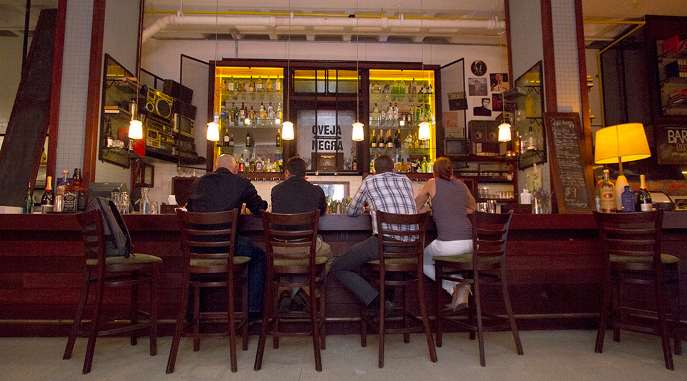 Vintage décor, sultry sounds, and crafted cocktails blend into a seductive mix at Oveja Negra.