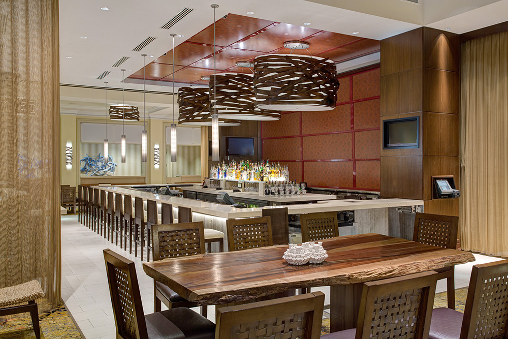 The Red Coral Lounge at San Juan Marriott Resort & Stellaris Casino overlooks both the bustling Ashford Avenue and de lush pool and beachfront areas.